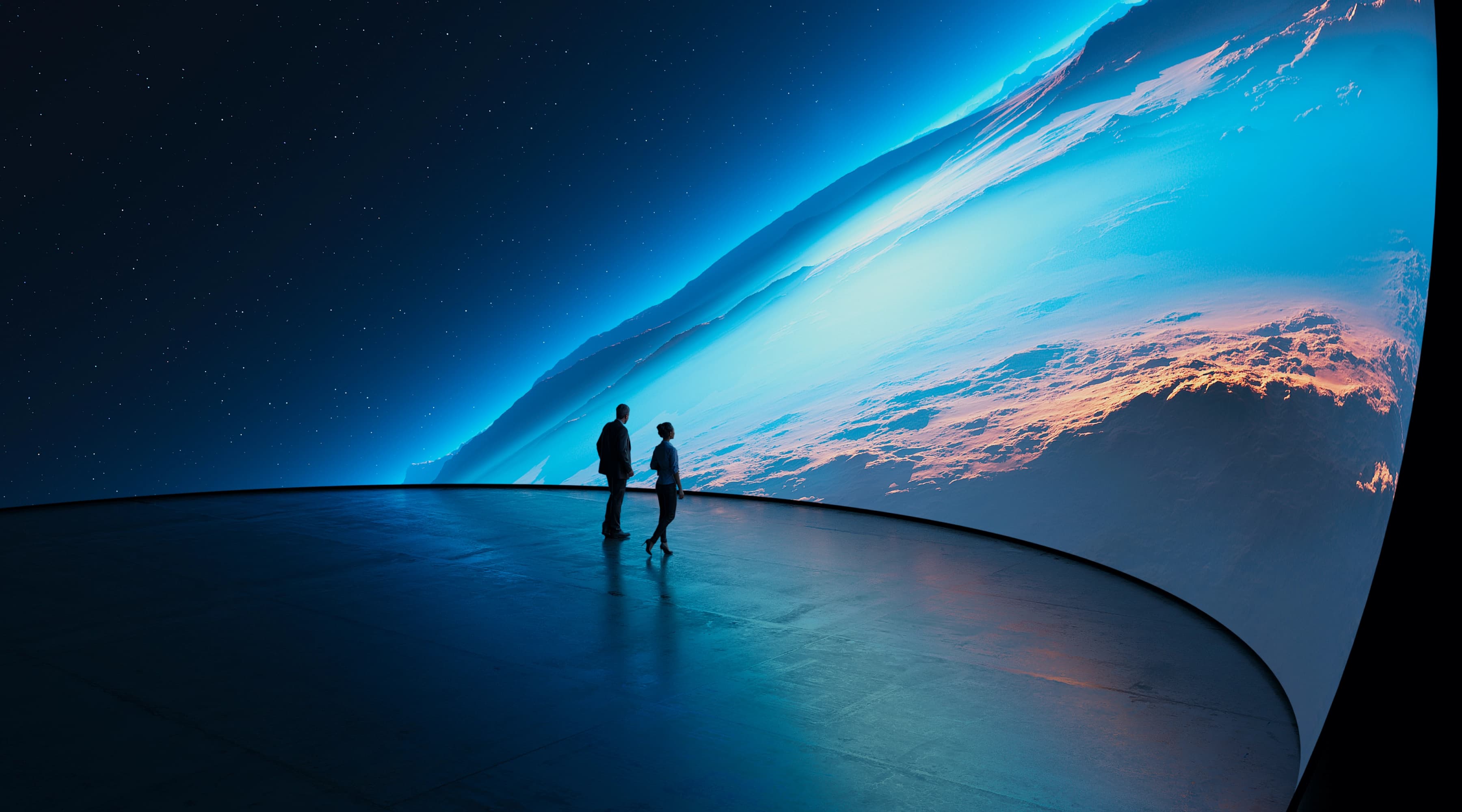 Visitors viewing Earth imagery on a spherical SFERiX LED screen